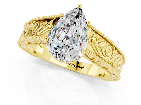 Yellow gold Pear Cut Moissanite Solitaire Ring with Engraved Band and Four-Prong Setting_1
