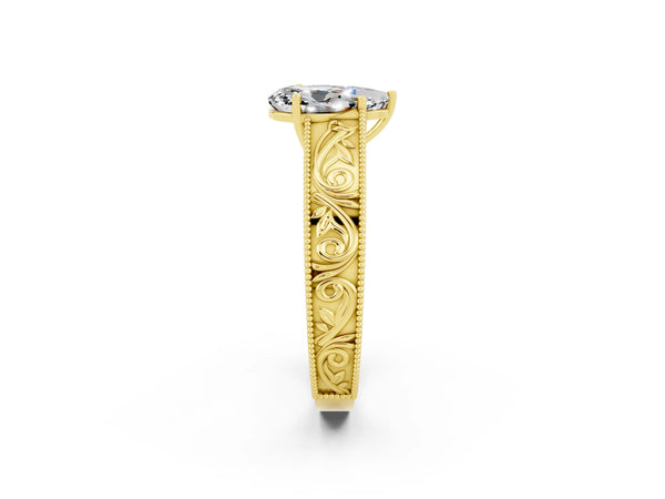 Yellow gold Pear Cut Moissanite Solitaire Ring with Engraved Band and Four-Prong Setting