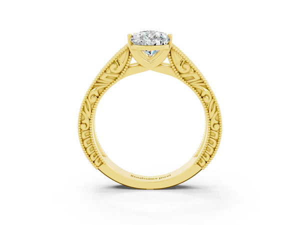 Yellow gold Pear Cut Moissanite Solitaire Ring with Engraved Band and Four-Prong Setting