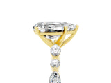 Yellow gold Pear Cut Moissanite Solitaire with Side Stones on a Pavé Band and Four-Prong Setting_5