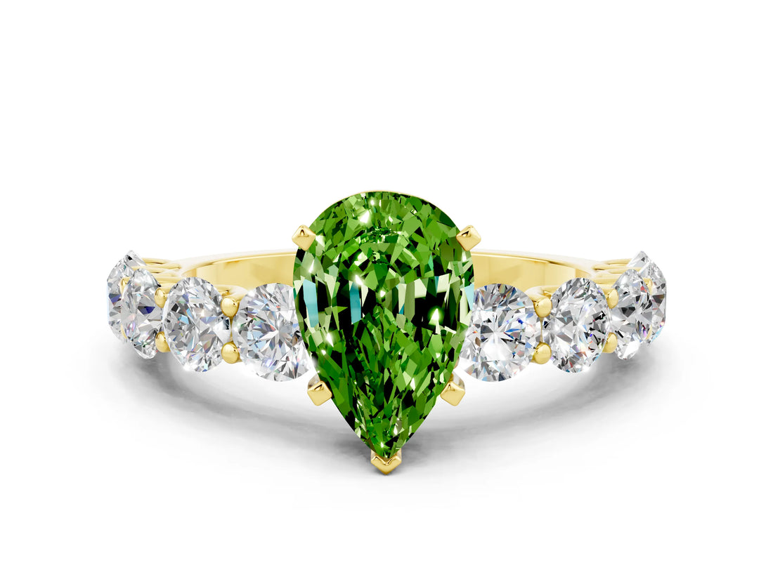 Yellow gold Pear Cut Peridot Prong Setting with Side Stones on a Pave Band