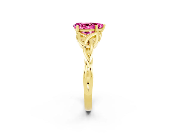 Yellow gold Pear Cut Pink Sapphire Solitaire Engagement Ring with Celtic Knot Band and Four-Prong Setting