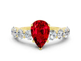 Yellow gold Pear Cut Ruby Prong Setting with Side Stones on a Pave Band
