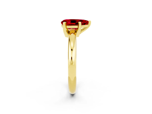 Yellow gold Pear Cut Ruby Solitaire Engagement Ring with Round Band and Four-Prong Setting