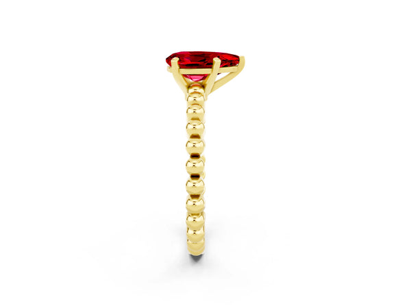 Yellow gold Pear Cut Ruby Solitaire Ring with Beaded Band and Prong Setting