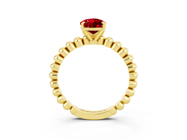 Yellow gold Pear Cut Ruby Solitaire Ring with Beaded Band and Prong Setting