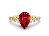 Yellow gold Pear Cut Ruby Solitaire Ring with Cathedral Setting and Pavé Band