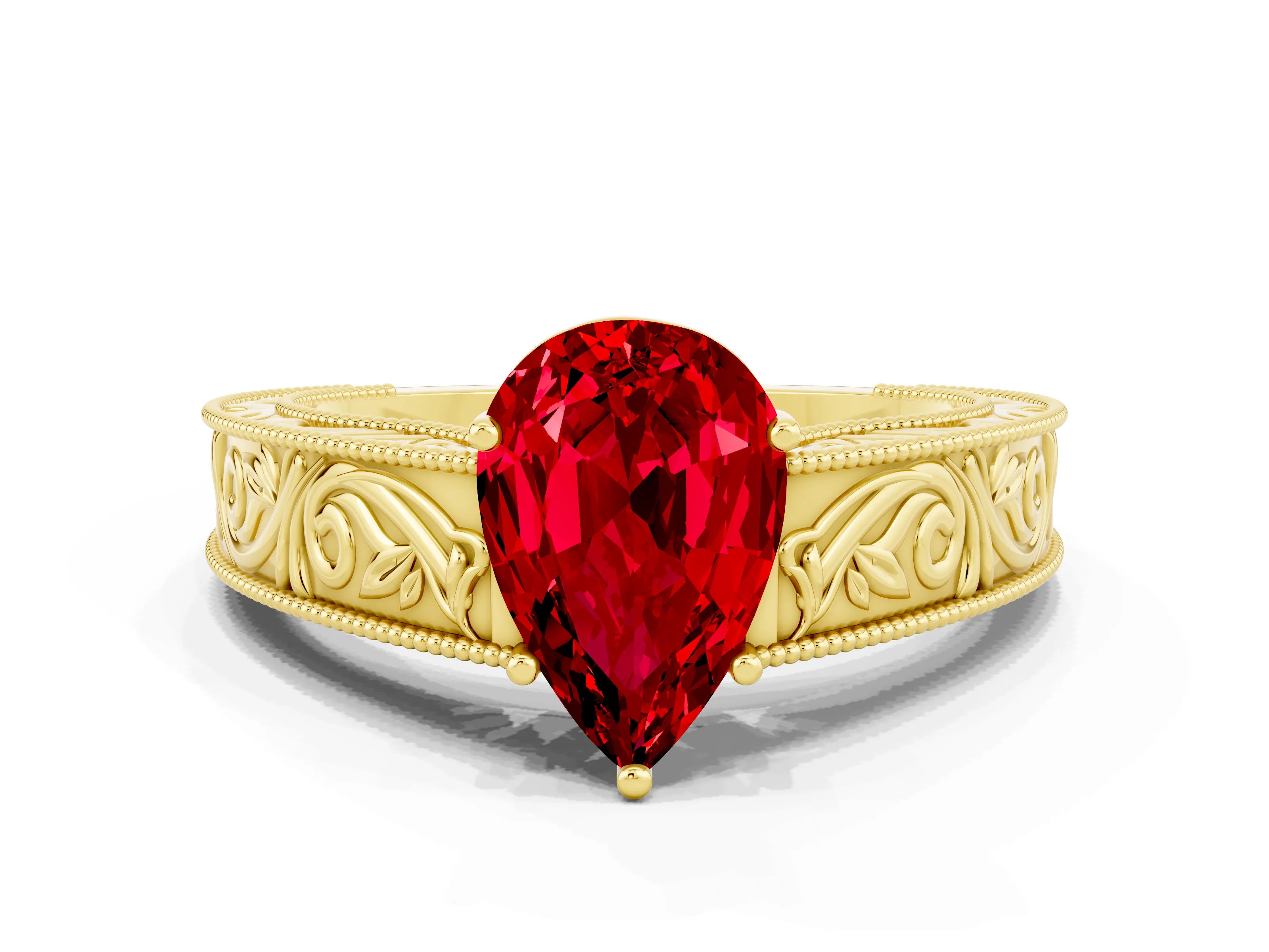 Yellow gold Pear Cut Ruby Solitaire Ring with Engraved Band and Four-Prong Setting