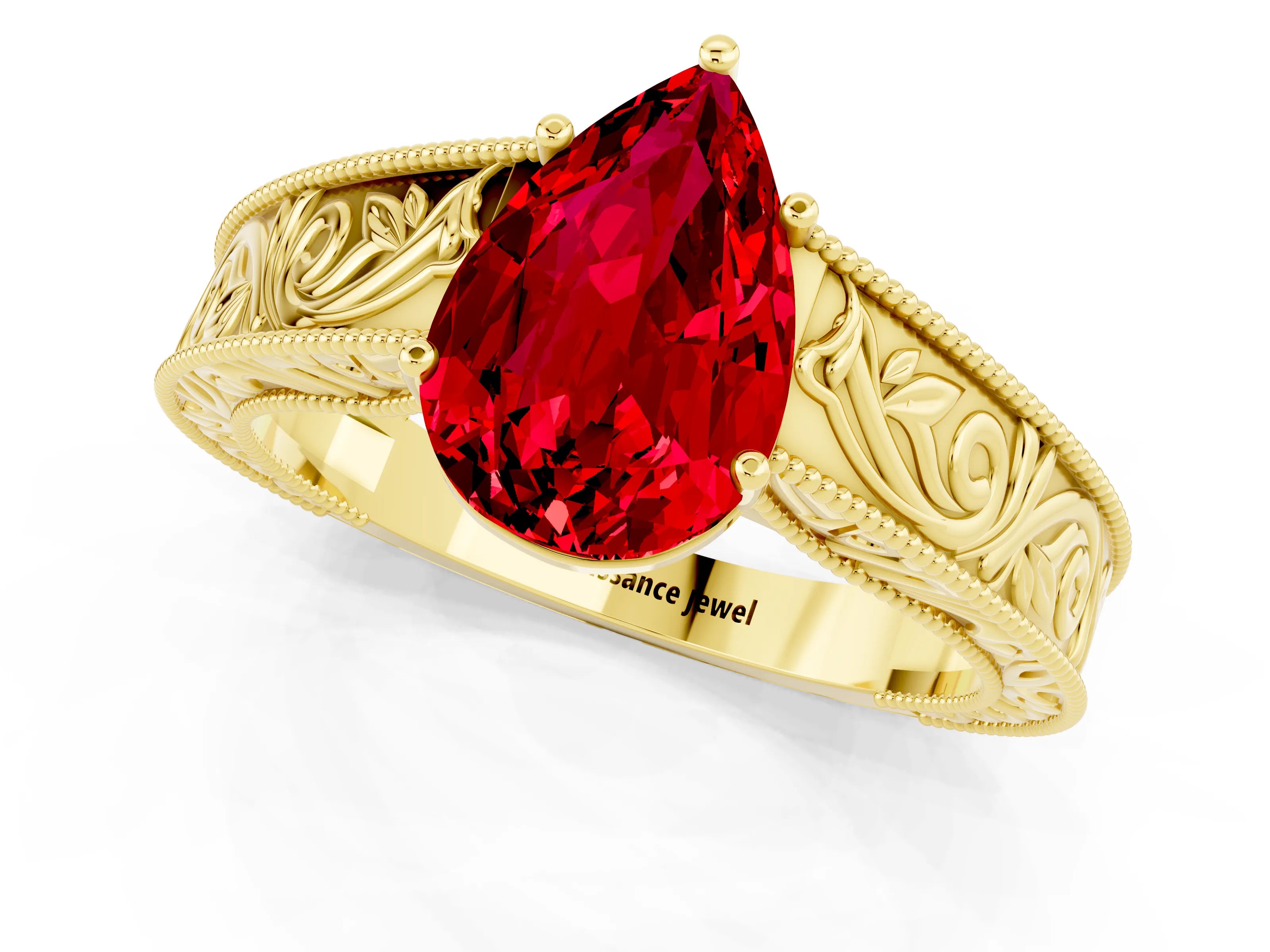 Yellow gold Pear Cut Ruby Solitaire Ring with Engraved Band and Four-Prong Setting_1