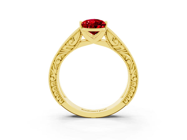Yellow gold Pear Cut Ruby Solitaire Ring with Engraved Band and Four-Prong Setting