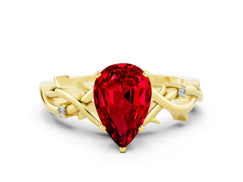 Yellow gold Pear Cut Ruby Solitaire Ring with Twisted Band and Prong Setting