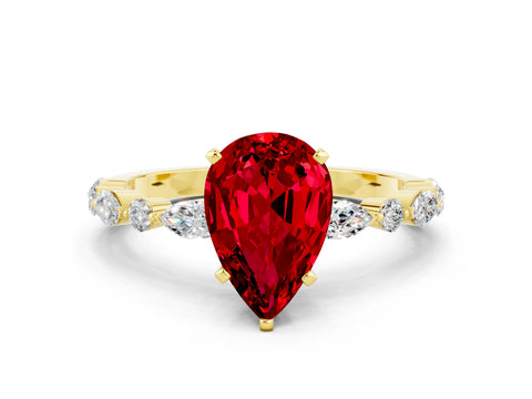 Yellow gold Pear Cut Ruby Solitaire with Side Stones on a Pavé Band and Four-Prong Setting