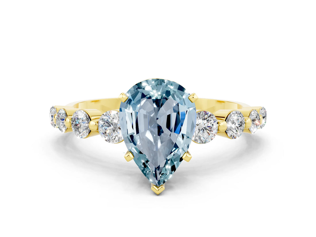 Yellow gold Pear Cut Solitaire Aquamarine Ring with Pave Band and Four-Prong Setting