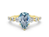 Yellow gold Pear Cut Solitaire Aquamarine Ring with Pave Band and Four-Prong Setting