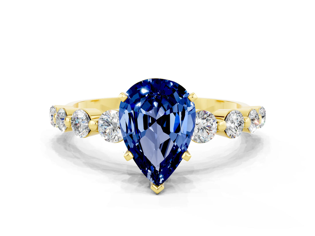 Yellow gold Pear Cut Solitaire Blue Sapphire Ring with Pave Band and Four-Prong Setting