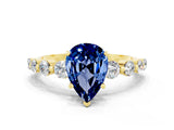 Yellow gold Pear Cut Solitaire Blue Sapphire Ring with Pave Band and Four-Prong Setting