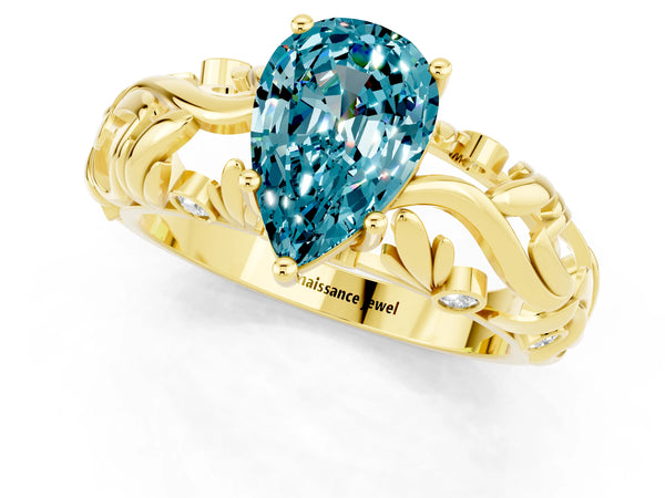 Yellow gold Pear Cut Solitaire Blue Topaz Leaf-Inspired Vine Band Ring with Prong Setting