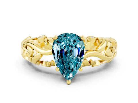 Yellow gold Pear Cut Solitaire Blue Topaz Leaf-Inspired Vine Band Ring with Prong Setting