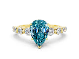 Yellow gold Pear Cut Solitaire Blue Topaz Ring with Pave Band and Four-Prong Setting