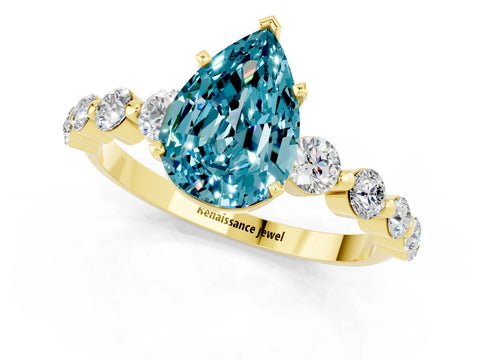 Yellow gold Pear Cut Solitaire Blue Topaz Ring with Pave Band and Four-Prong Setting_1