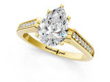 Yellow gold Pear Cut Solitaire Cathedral Diamond Engagement Ring with Channel-Set Band and Four-Prong Setting_8