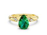 Yellow gold Pear Cut Solitaire Diamond Engagement Ring with Twisted Pave Band and Four-Prong Setting