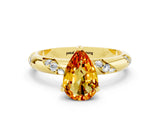 Yellow gold Pear Cut Solitaire Diamond Engagement Ring with Twisted Pave Band and Four-Prong Setting