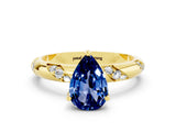 Yellow gold Pear Cut Solitaire Diamond Engagement Ring with Twisted Pave Band and Four-Prong Setting