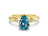 Yellow gold Pear Cut Solitaire Diamond Engagement Ring with Twisted Pave Band and Four-Prong Setting