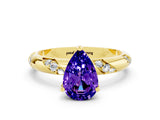 Yellow gold Pear Cut Solitaire Diamond Engagement Ring with Twisted Pave Band and Four-Prong Setting