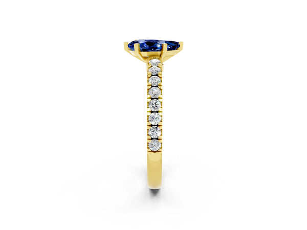 Yellow gold Pear Cut Solitaire Blue Sapphire with Pavé Band and Four-Prong Setting