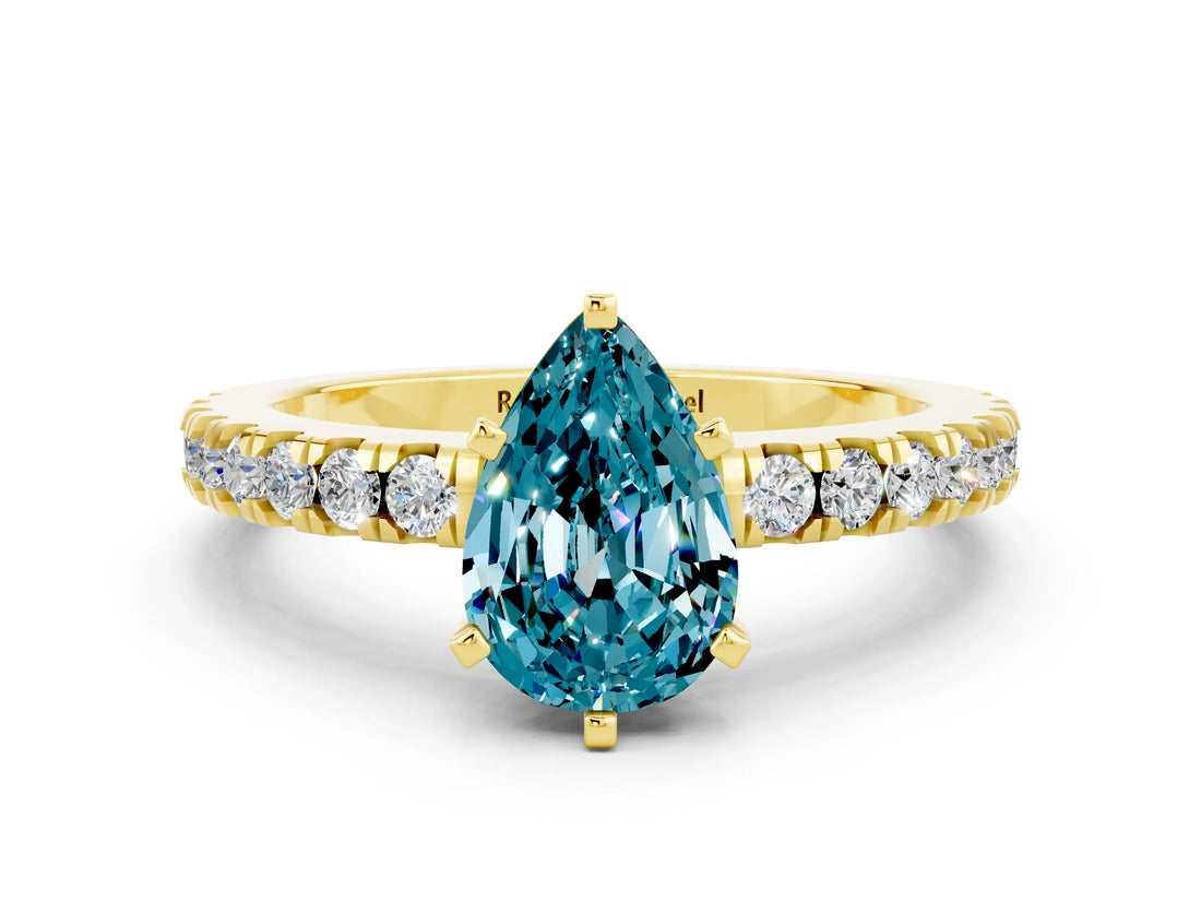 Yellow gold Pear Cut Solitaire Diamond with Pavé Band and Four-Prong Setting