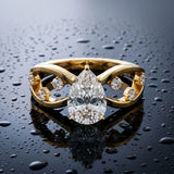 Yellow gold Pear Cut Solitaire Diamond with Side Stones on Criss-Cross Band and Four-Prong Setting_16