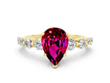 Yellow gold Pear Cut Solitaire Garnet Ring with Pave Band and Four-Prong Setting