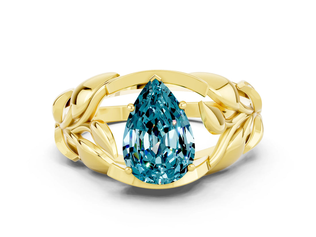 Yellow gold Pear Cut Solitaire Leaf-Inspired Engagement Ring with Prong Setting