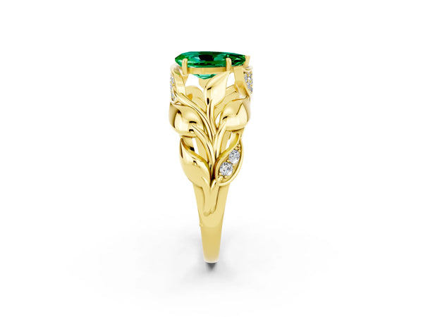 Yellow gold Pear Cut Emerald Leaf-Inspired Engagement Ring with Round Accents and Prong Setting