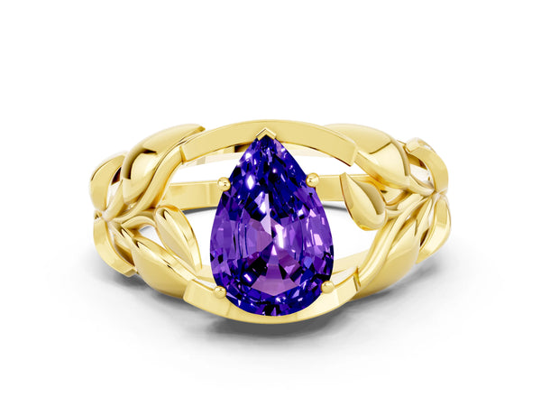 Yellow gold Pear Cut Tanzanite Leaf-Inspired Engagement Ring with Round Accents and Prong Setting