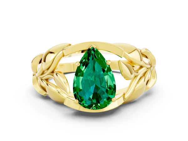 Yellow gold Pear Cut Emerald Leaf-Inspired Engagement Ring with Round Accents and Prong Setting