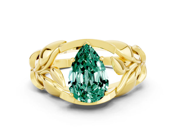 Yellow gold Pear Cut Green Sapphire Leaf-Inspired Engagement Ring with Round Accents and Prong Setting