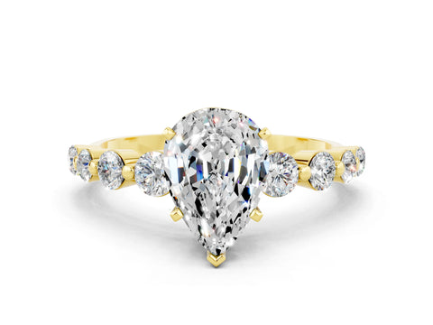Yellow gold Pear Cut Solitaire Moissanite Ring with Pave Band and Four-Prong Setting