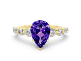 Yellow gold Pear Cut Solitaire Tanzanite Ring with Pave Band and Four-Prong Setting