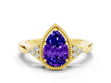 Yellow gold Pear Cut Tanzanite Halo Ring with Tapered Band and Four-Prong Setting