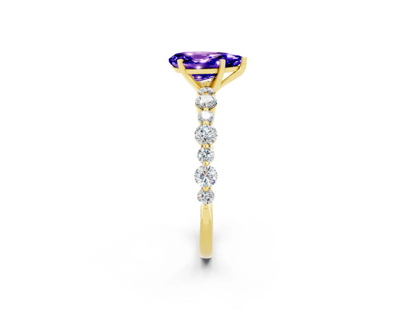 Yellow gold Pear Cut Tanzanite Prong Set Engagement Ring with Pavé Band