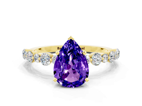 Yellow gold Pear Cut Tanzanite Prong Set Engagement Ring with Pavé Band