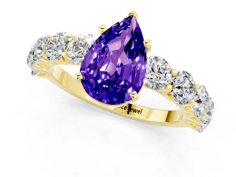 Yellow gold Pear Cut Tanzanite Prong Setting with Side Stones on a Pave Band_1