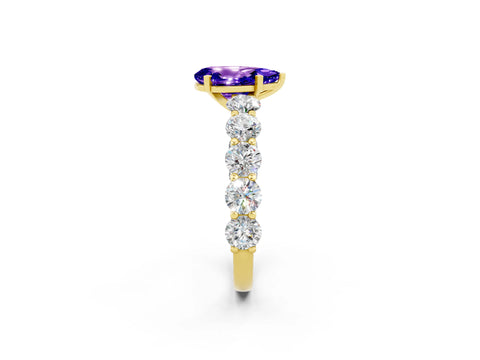 Yellow gold Pear Cut Tanzanite Prong Setting with Side Stones on a Pave Band_2
