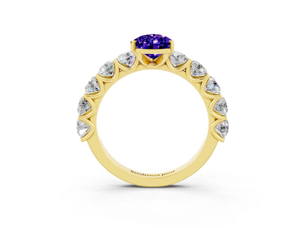 Yellow gold Pear Cut Tanzanite Prong Setting with Side Stones on a Pave Band