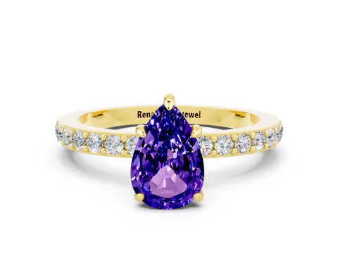 Yellow gold Pear Cut Tanzanite Ring with Pavé Band and Four-Prong Setting