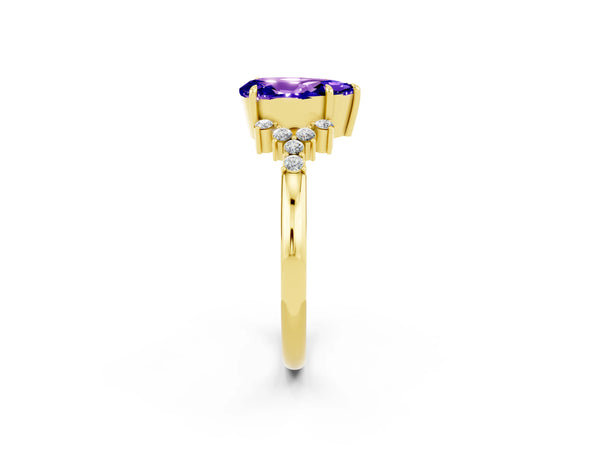 Yellow gold Pear Cut Tanzanite Ring with Side Stones and Four-Prong Setting