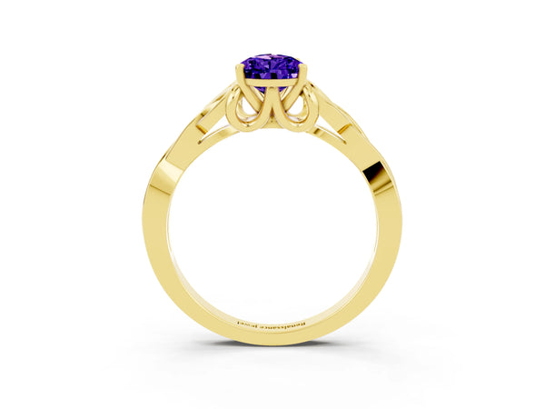 Yellow gold Pear Cut Tanzanite Solitaire Engagement Ring with Celtic Knot Band and Four-Prong Setting